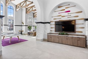A living room with a tv and a table